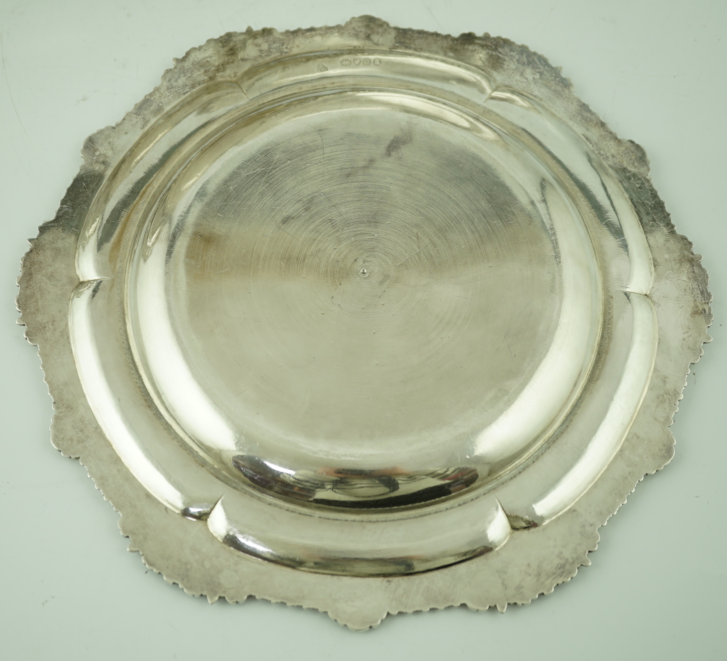 A set of four George IV silver dinner plates by Rundell, Bridge & Rundell
